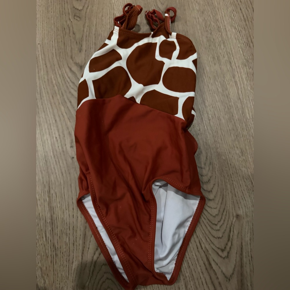 Coral reef giraffe print size 6 one piece